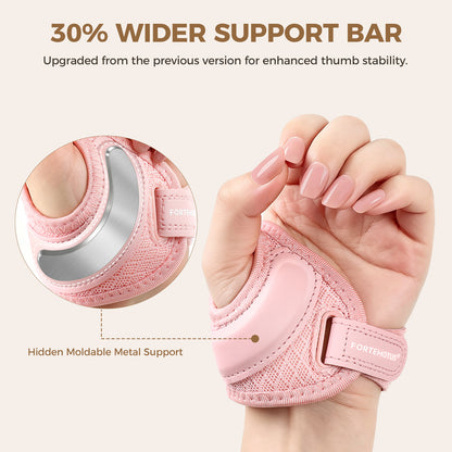 Pink FORTEMOTUS Upgraded Thumb Support worn on a hand. Zoom circle displays its hidden moldable metal support bar, with text about 30% wider support bar.