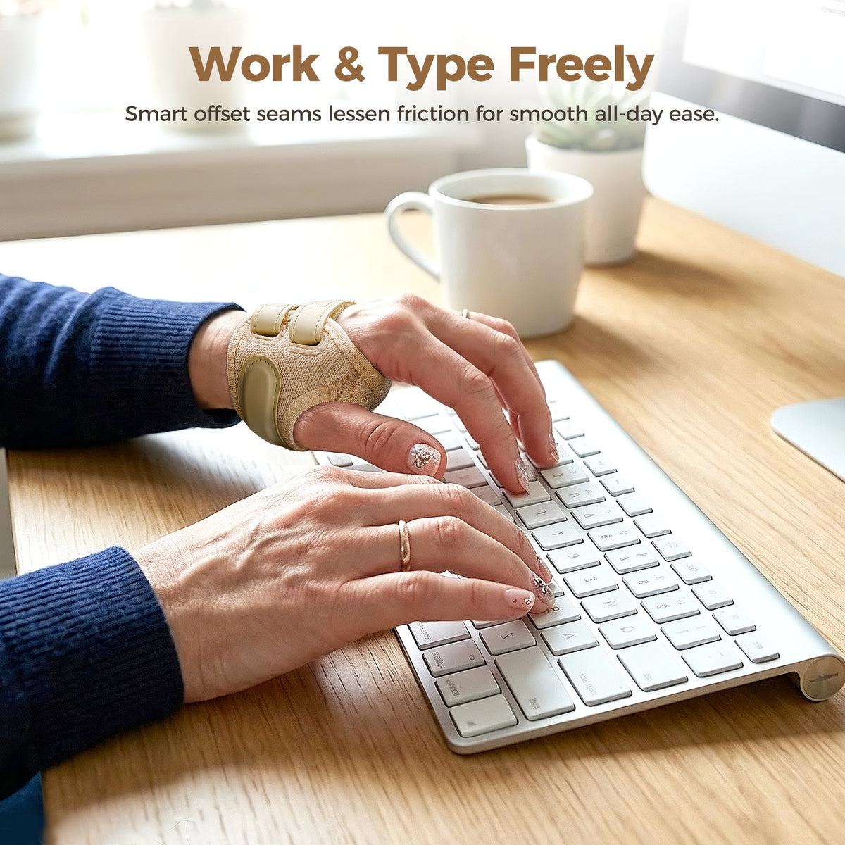 A person types on a white keyboard at a wooden desk, wearing beige FORTEMOTUS thumb brace. A coffee mug sits nearby. Top text reads "Work & Type Freely".